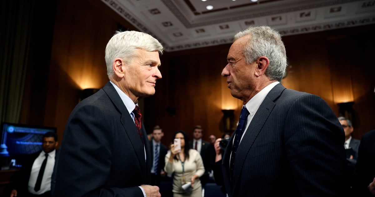 Robert F. Kennedy Jr., Secretary of Health and Human Services, speaks with Sen. Bill Cassidy after testifying in his Senate Committee on Health, Education, Labor and Pensions confirmation hearing on January 30, 2025 in Washington, DC.