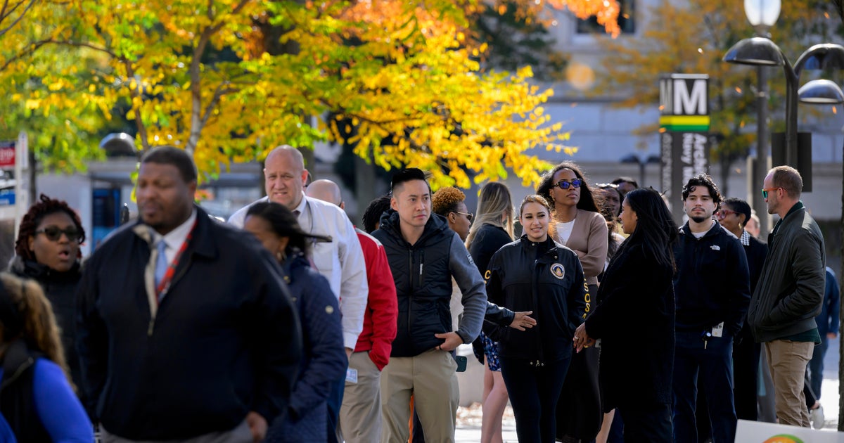 Hundreds of people wait in line as World Central Kitchen provides free meals to federal employees and their families during the government shutdown in Washington, D.C., on Wednesday, Nov. 5, 2025.